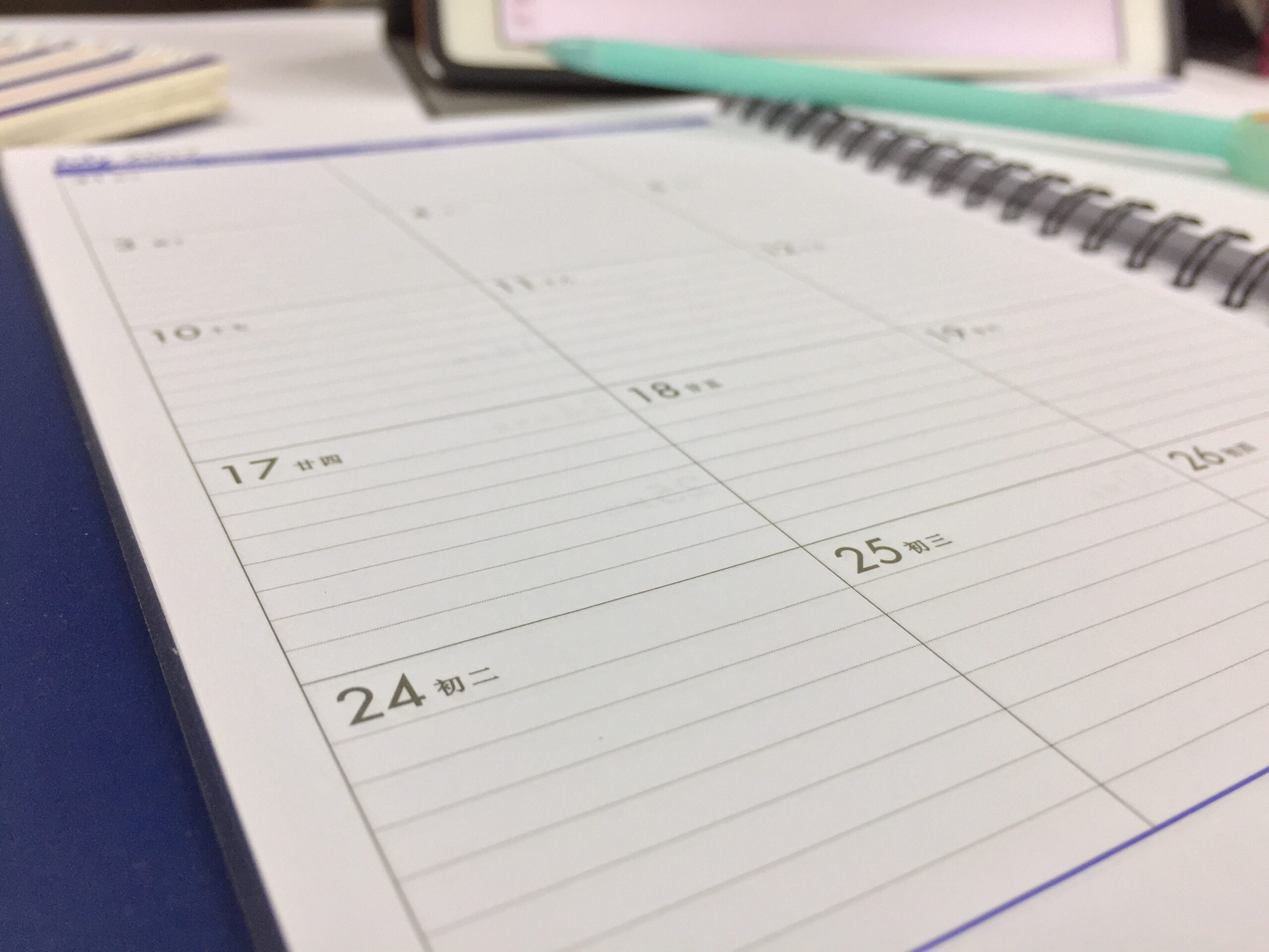 Photo of a blank, spiral bound calendar.